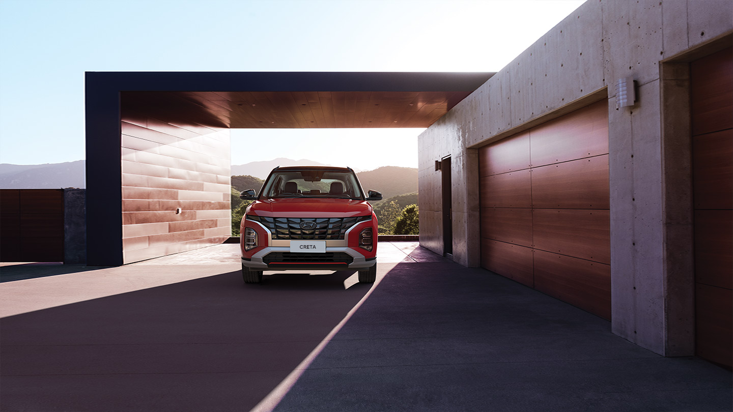 Hyundai Creta 2025 color rojo estacionada al atardecer